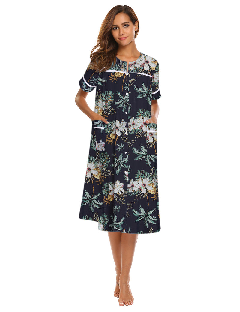 Button-down short-sleeve house dress in dark leaf and flower print with side pockets