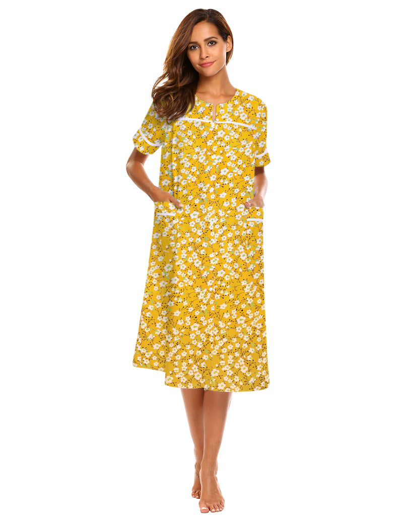 Button-down short-sleeve house dress in yellow daisy print with front buttons and pockets