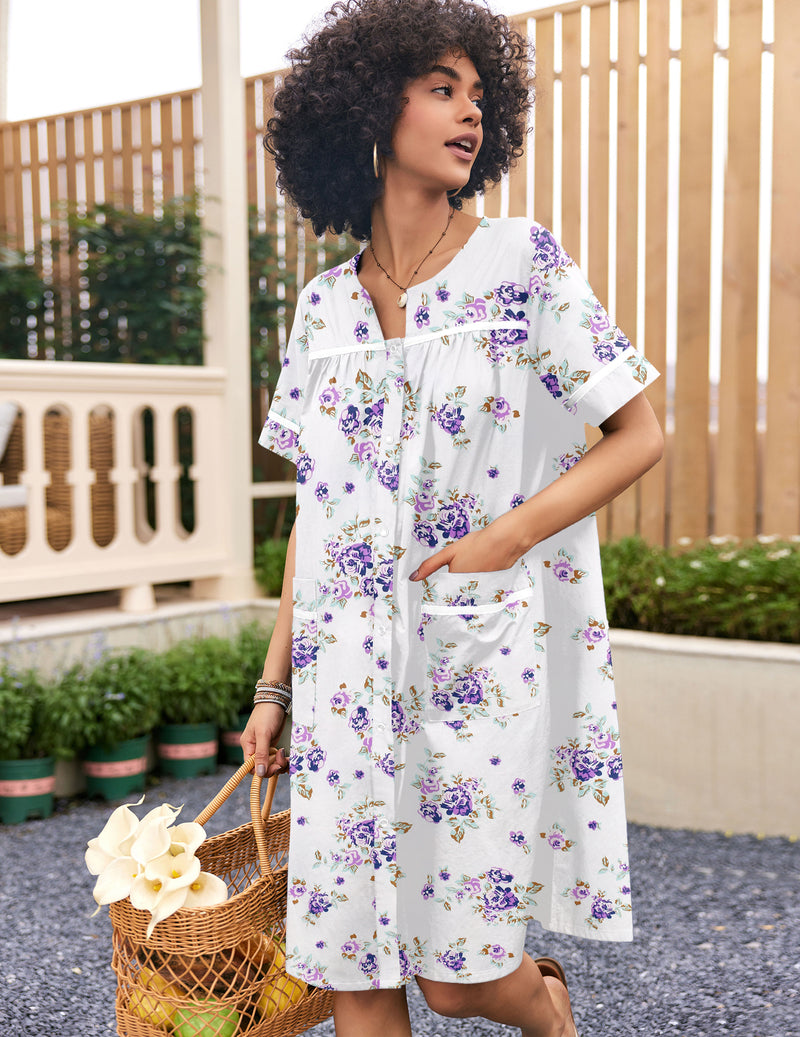 White snap-front short-sleeve cotton house coat with purple floral print and chest pocket