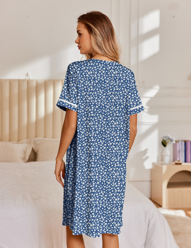 Cotton snap-front house coat in navy with white floral print, short sleeves, back view