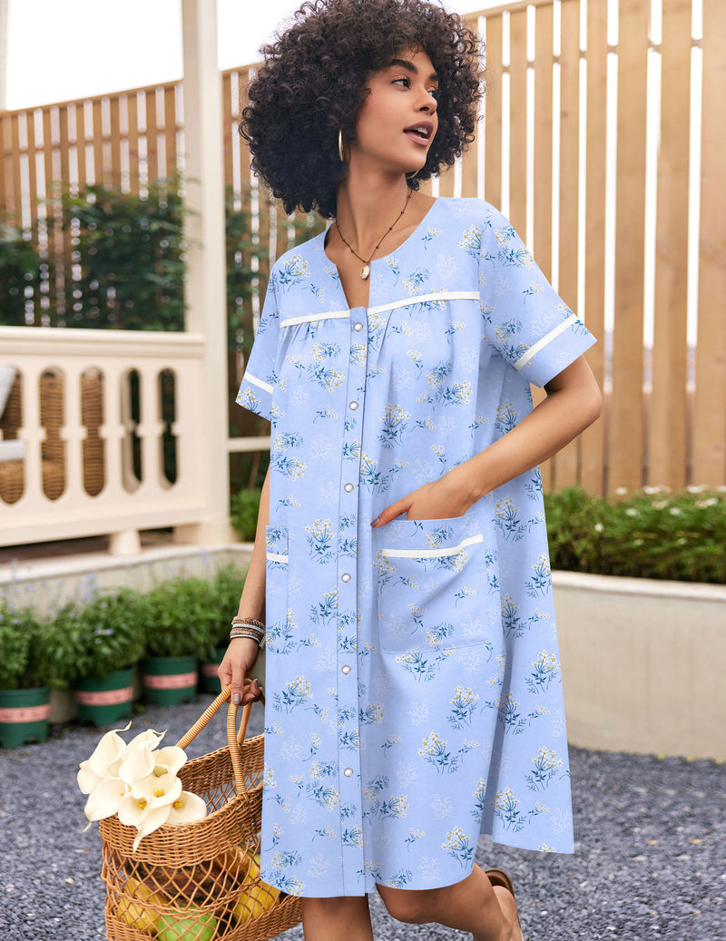 Cotton snap-front house coat in light blue with white floral print, short sleeves
