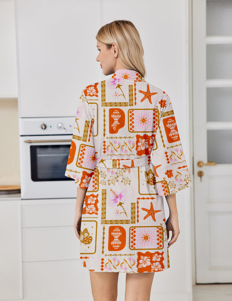 Orange patterned floral bathrobe with tie belt and three-quarter sleeves