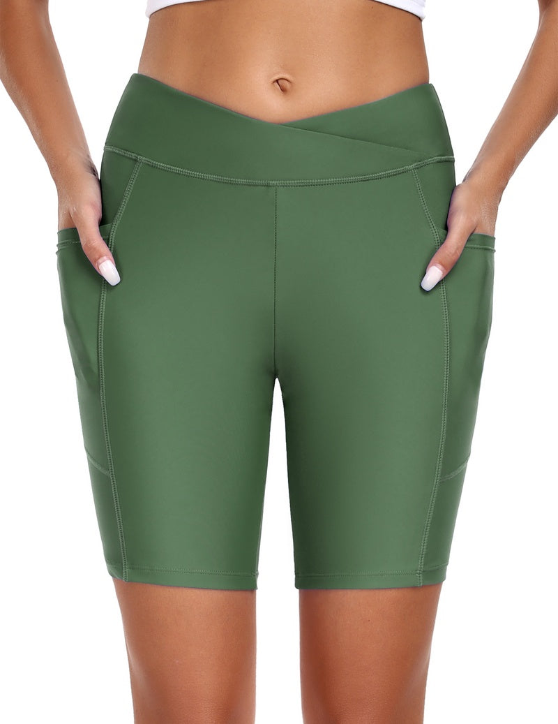 High waist board shorts with pockets in dark green, mid-thigh length