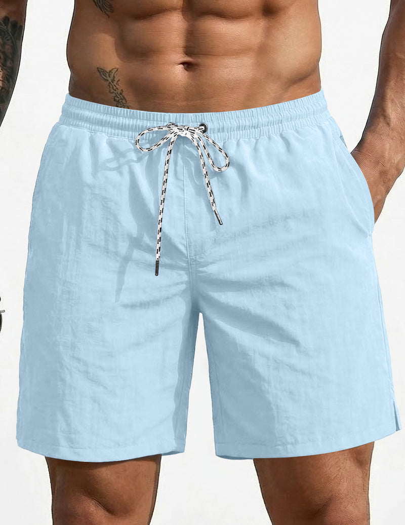 Light blue swim board shorts with elastic waistband and drawstring, 7-inch length