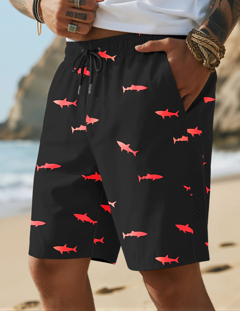Black swim trunks with red fish print, elastic waistband, and drawstring