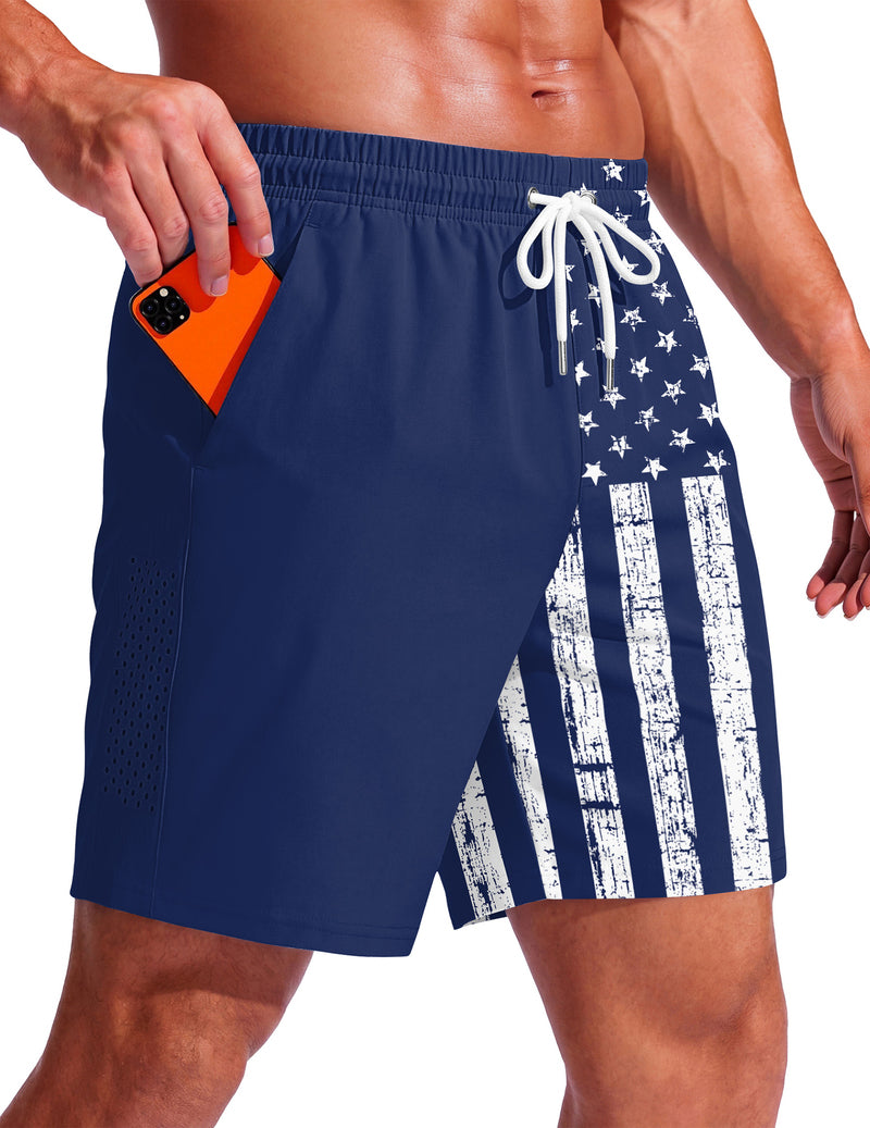 Men's swim trunks, 7-inch navy with stars and stripe flag print, drawstring waist.