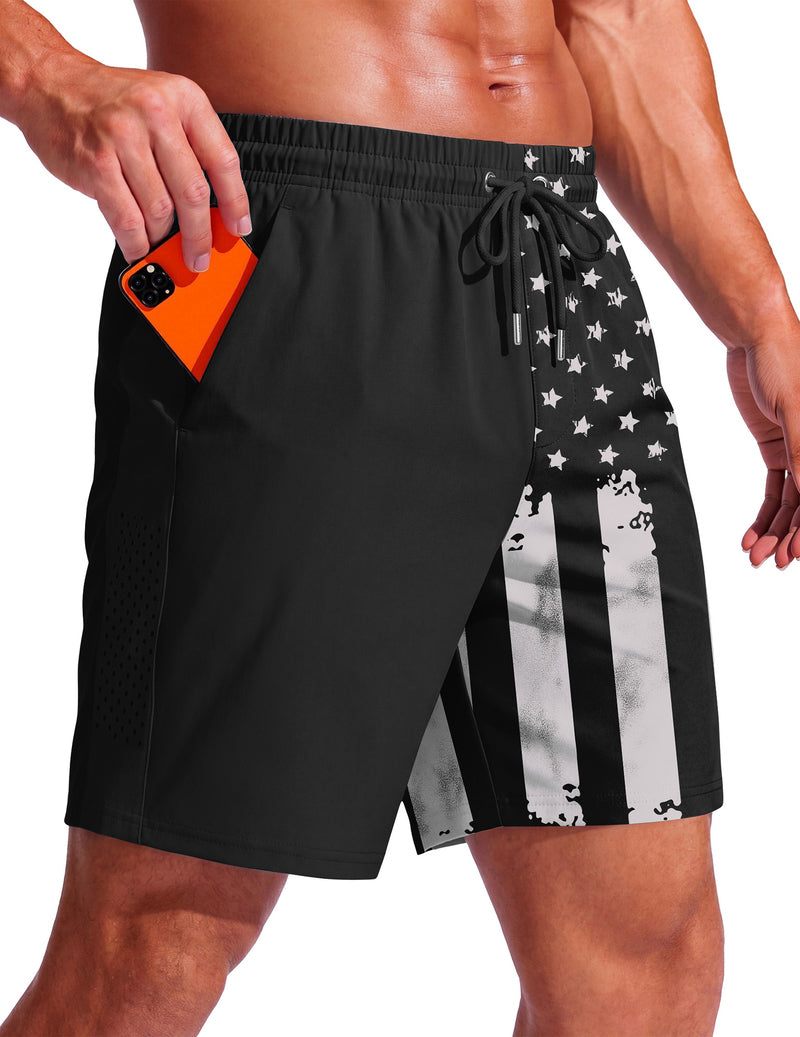 Men's swim trunks, 7-inch black with stars and stripe flag print, drawstring waist.