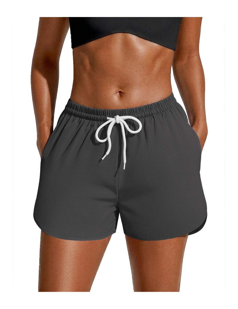 Dark grey swim board shorts with white drawstring and elastic waist