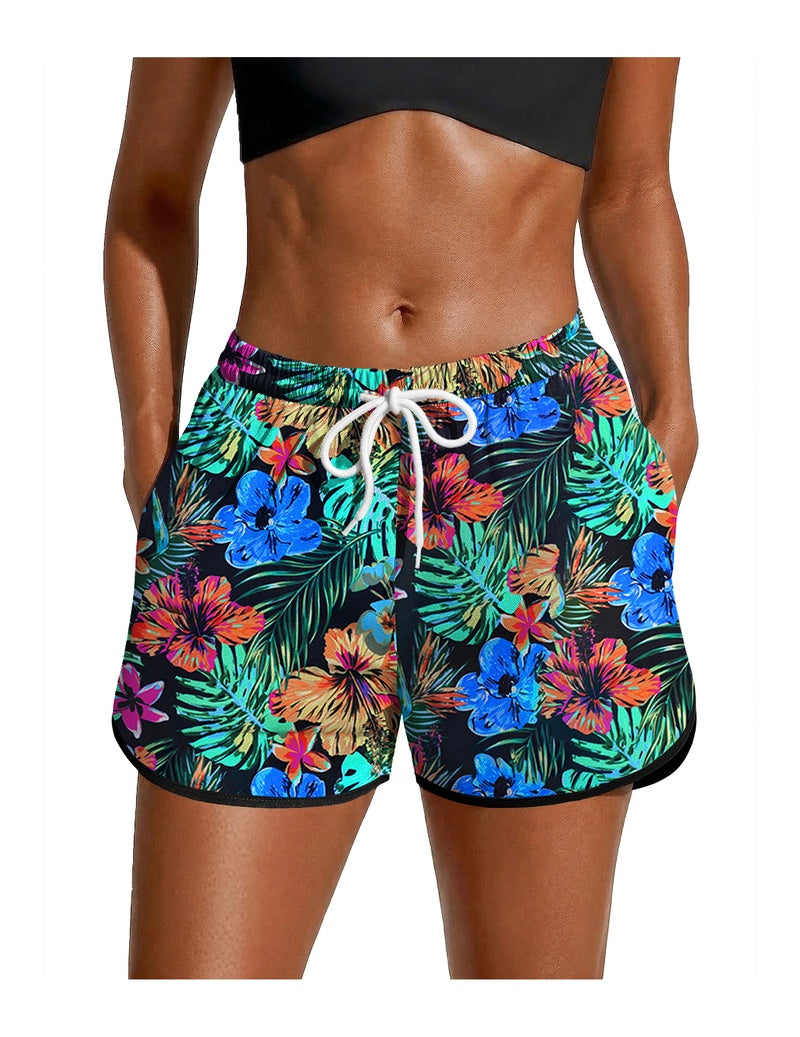 Tropical floral swim board shorts with drawstring waist and black trim