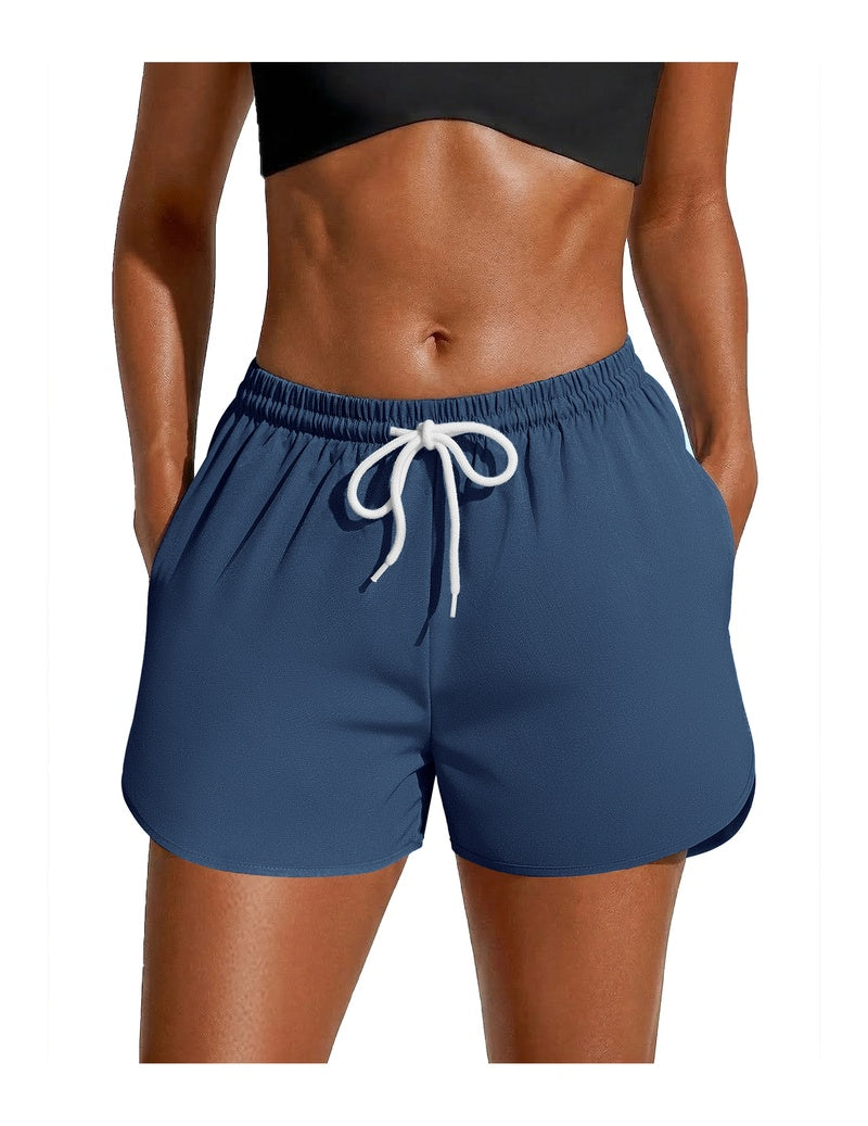 Navy swim board shorts with white drawstring waist