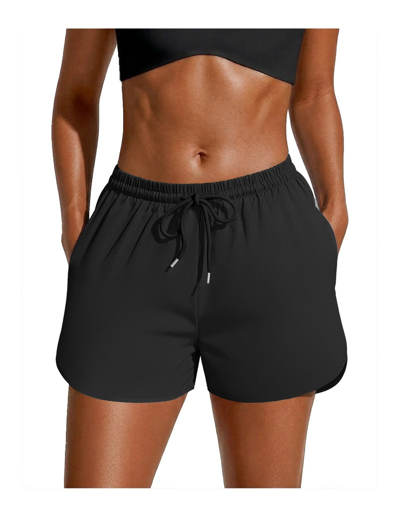 Black swim board shorts with black drawstring waist