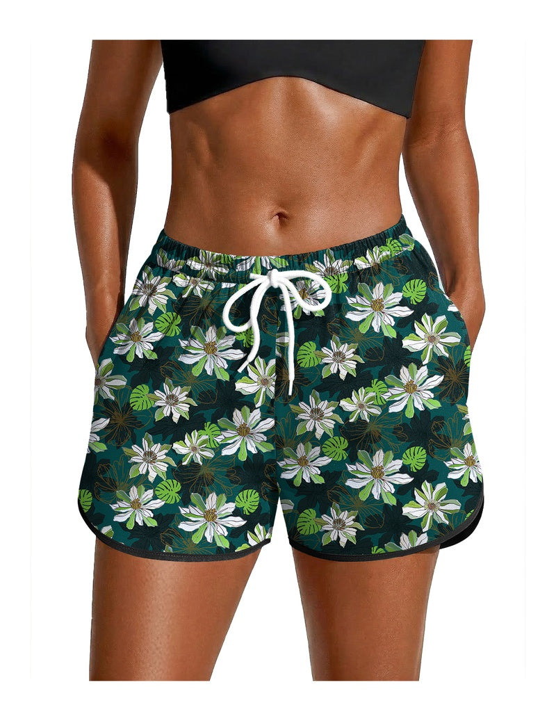 Green floral swim board shorts with white drawstring waist