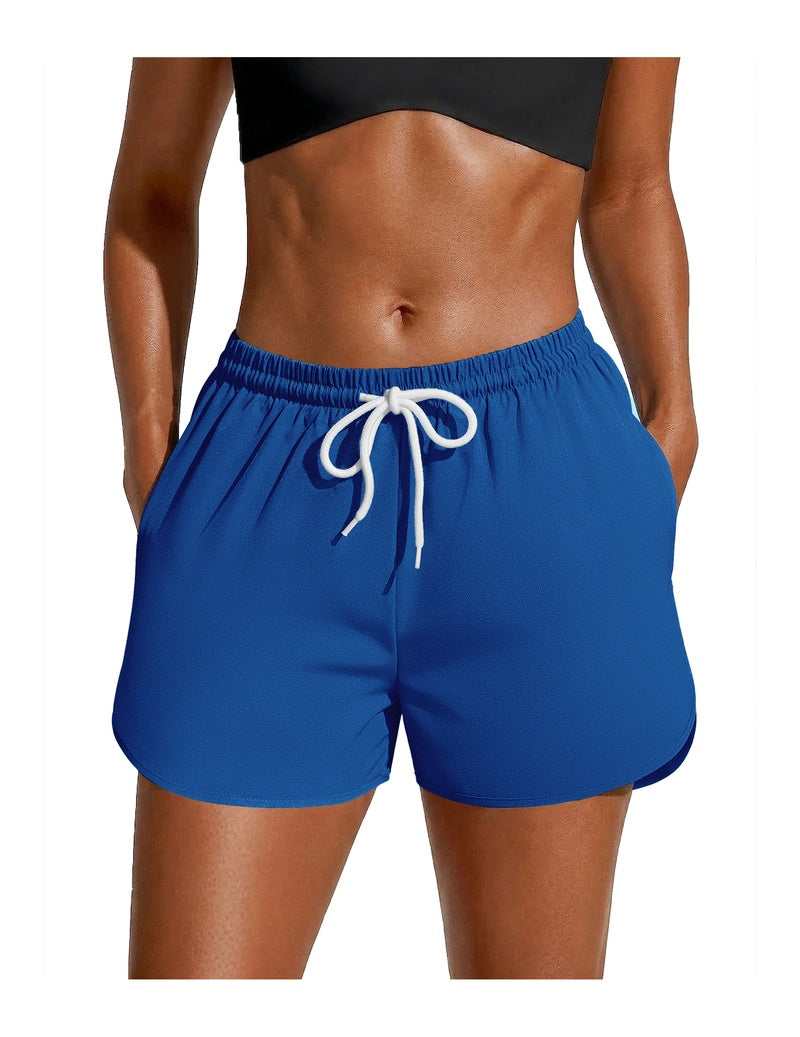 Blue swim board shorts with white drawstring waist