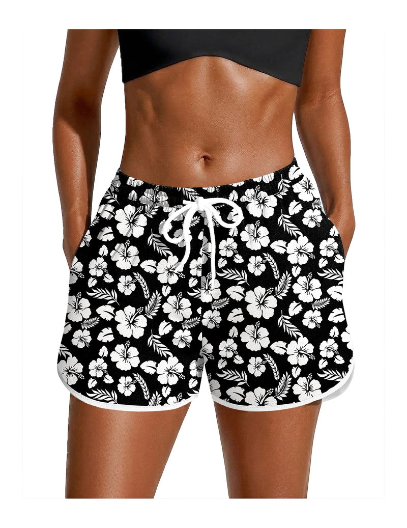 Black floral swim board shorts with white drawstring waist