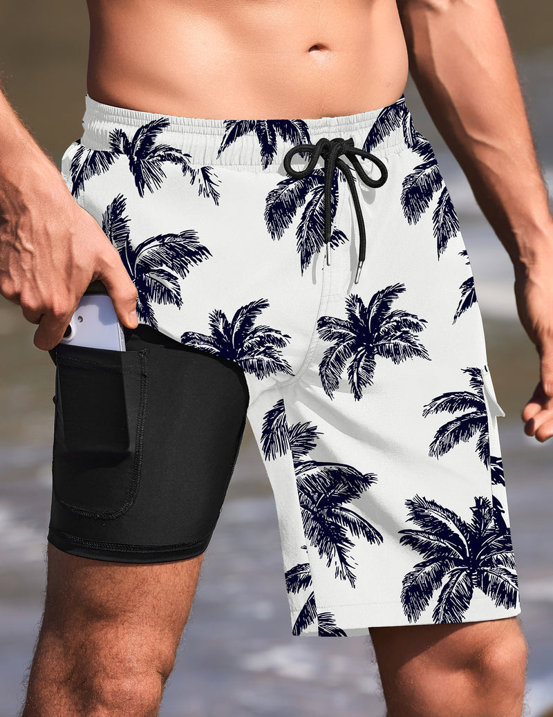 White palm-print swim trunks with drawstring, black compression liner.