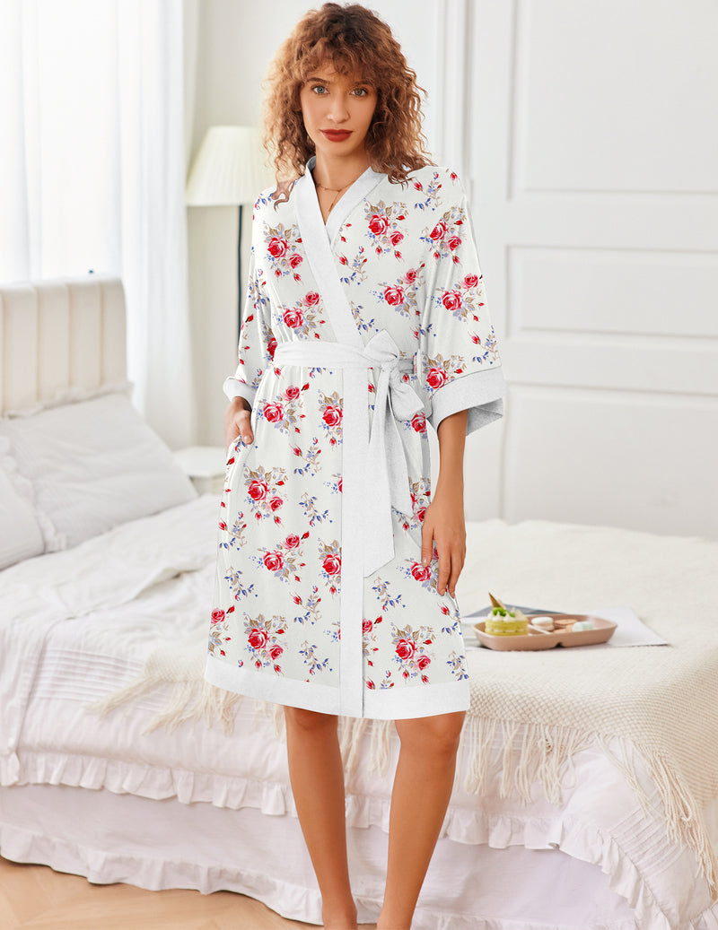 White knit kimono robe with red floral print, 3/4 sleeves, knee length, tied belt