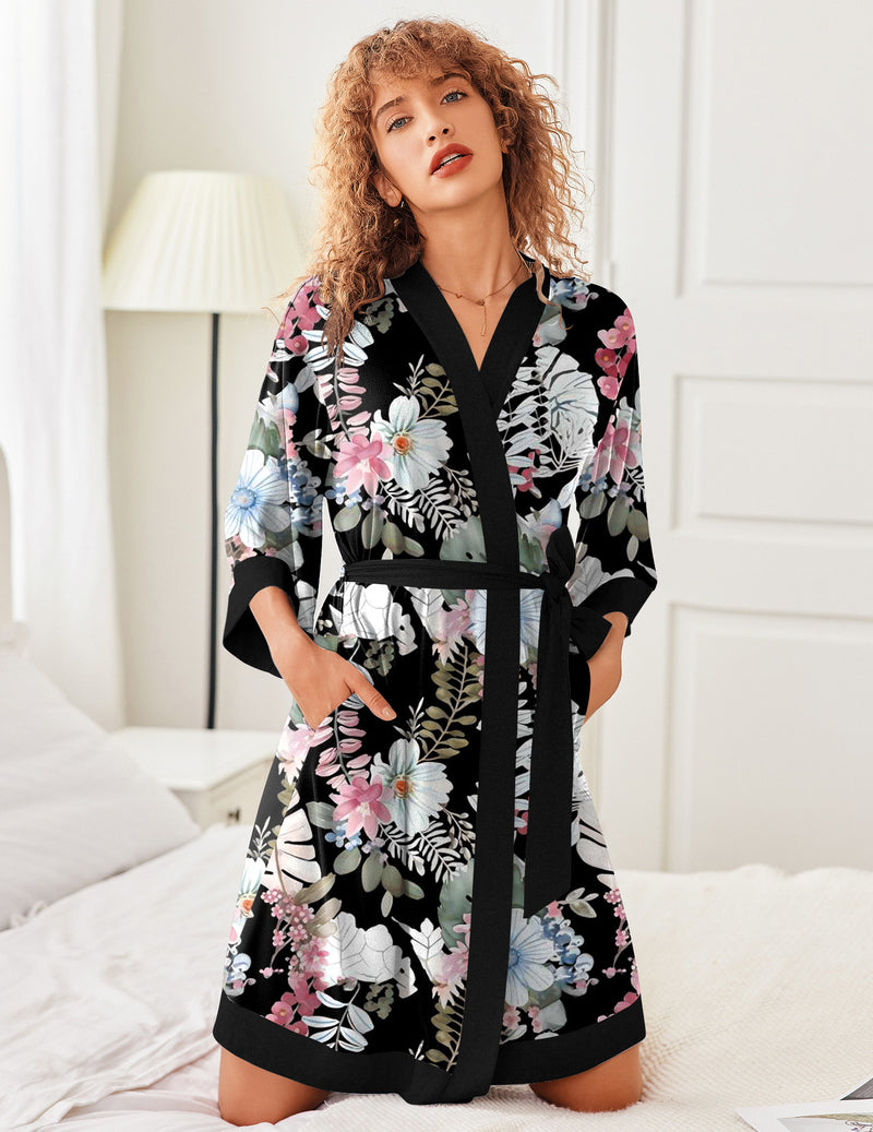 Lightweight knit kimono robe with black base and colorful floral print, tie belt