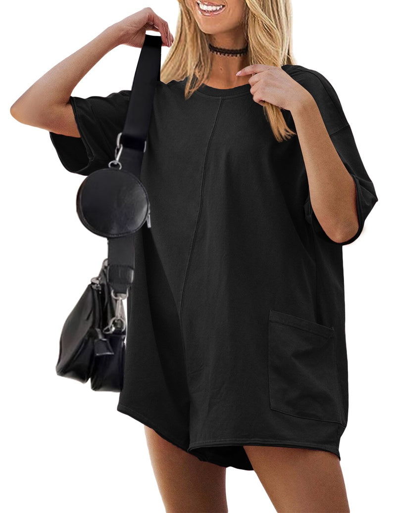 Black reversible oversized romper with short sleeves and front patch pocket