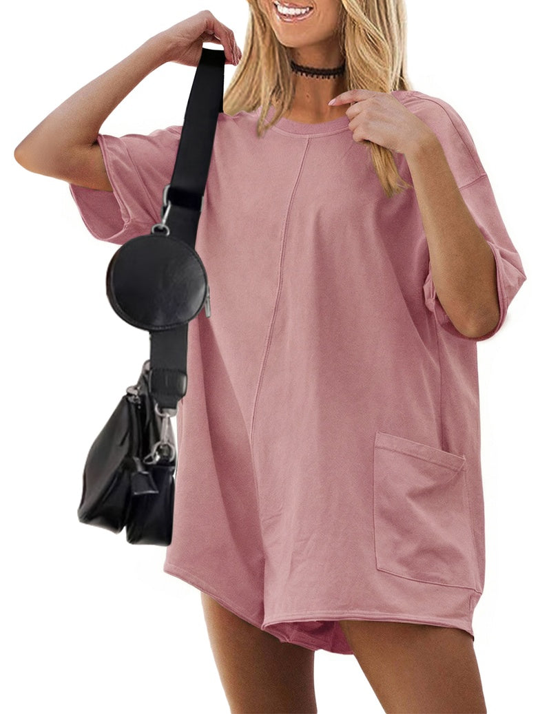 Dusty pink reversible oversized romper with short sleeves and front patch pocket