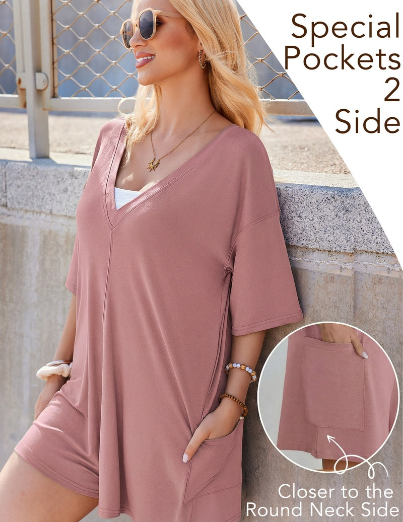 Mauve V-neck oversized romper with short sleeves and side pocket detail