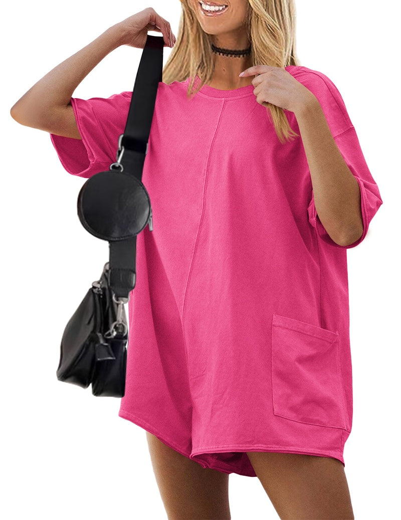 Hot pink oversized V-neck romper with short sleeves and front pocket