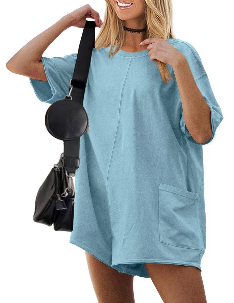 Light blue oversized V-neck romper with short sleeves and front pocket