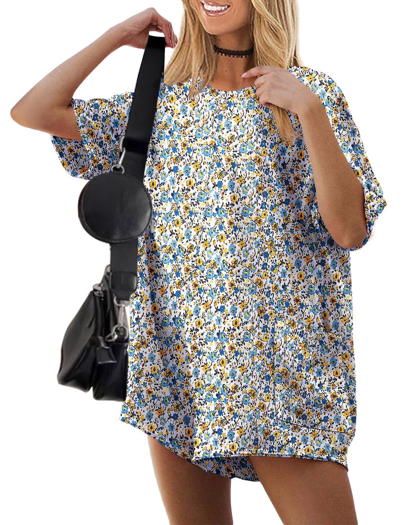 Yellow floral V-neck oversized romper with short sleeves and front pocket