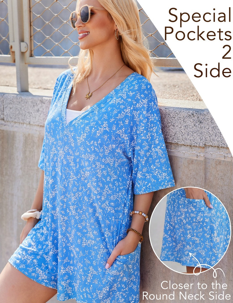Blue floral V-neck oversized romper with short sleeves and side pocket detail