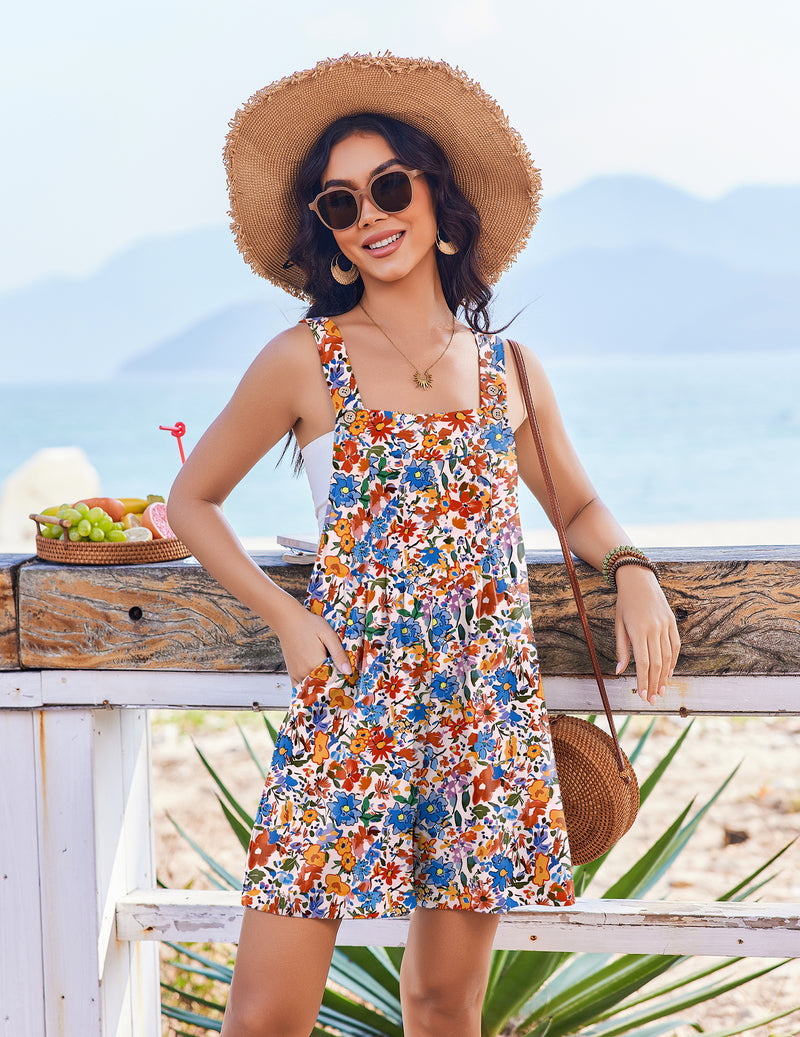 Blue floral sleeveless short overalls romper with buttoned straps and full skirt hem
