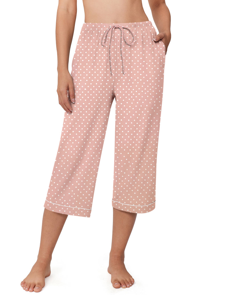 Pink capri pajama pants with small white dot print and drawstring waistband