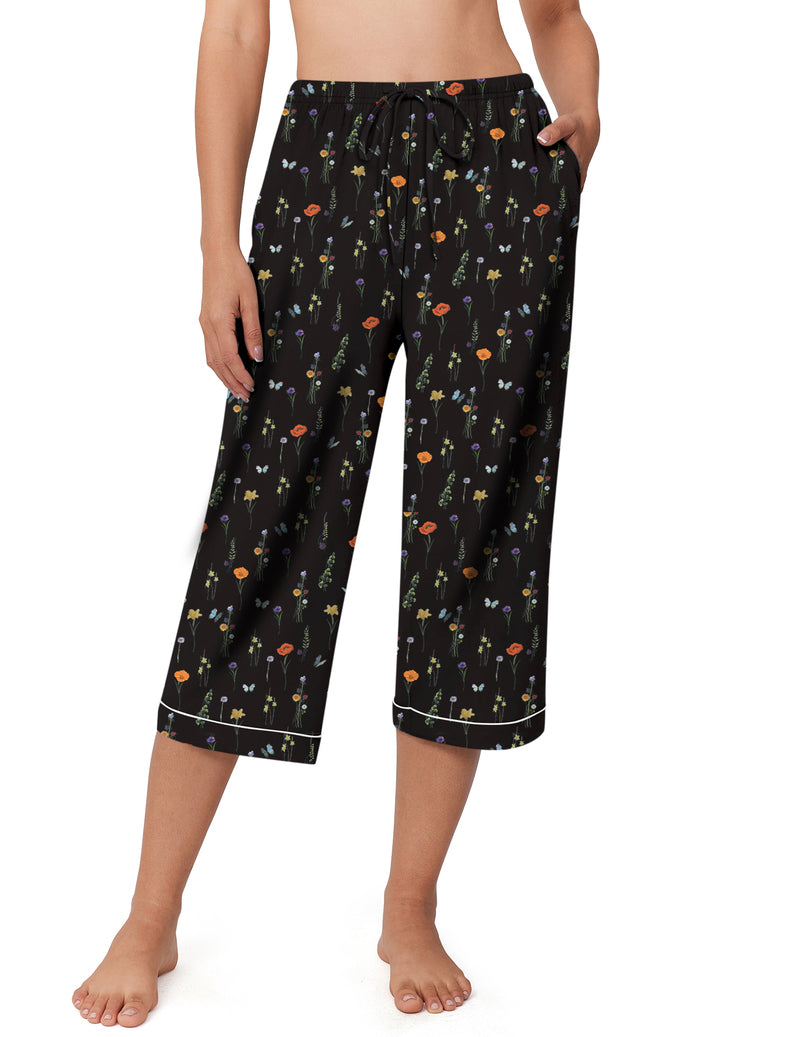 Black capri pajama pants with small multicolor flower print and drawstring waist
