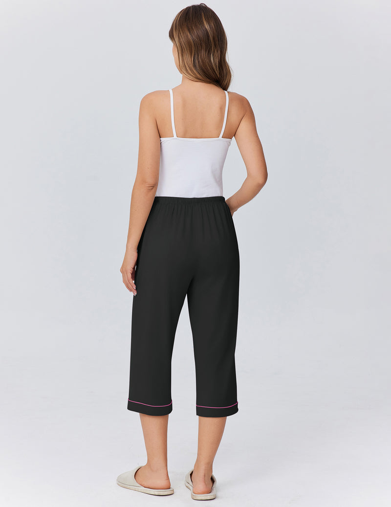 Capri pajama pants in black with red piping trim, elastic drawstring waist