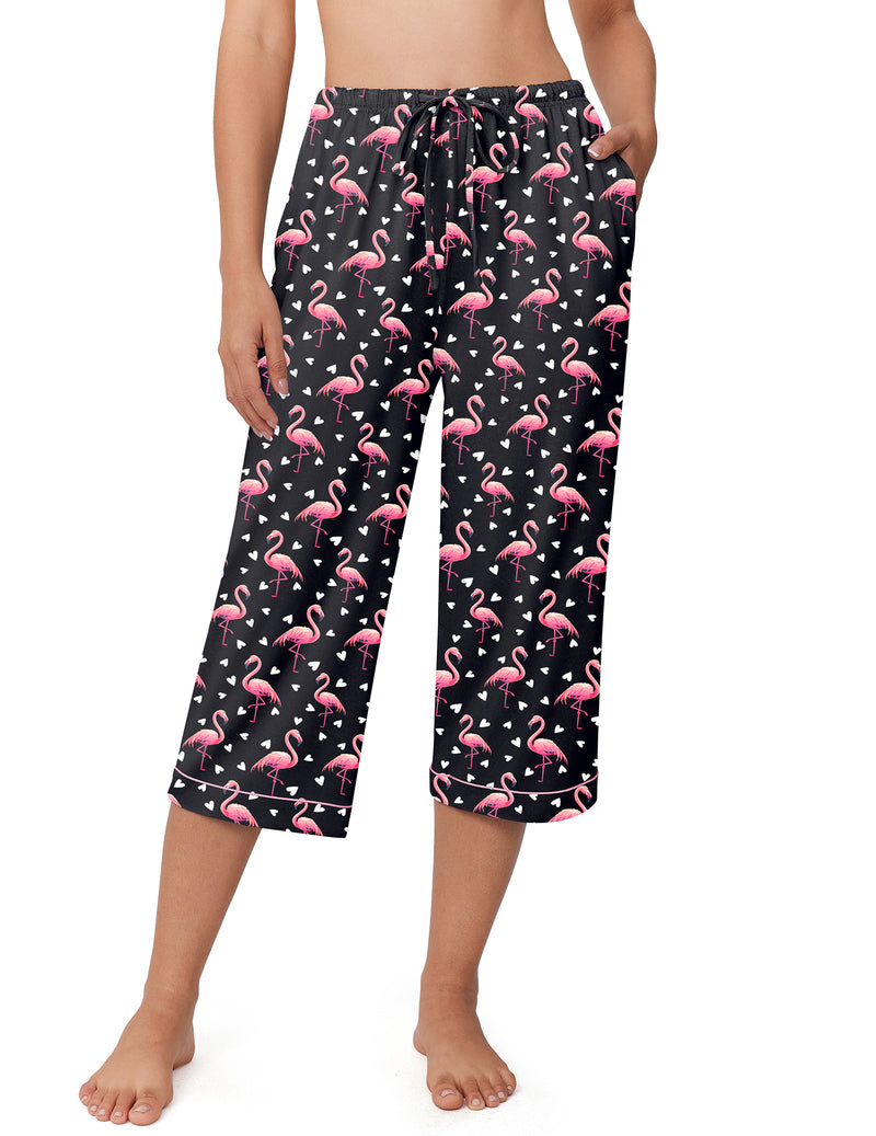 Black capri pajama pants with pink flamingo print, drawstring waist, red-trim cuffs