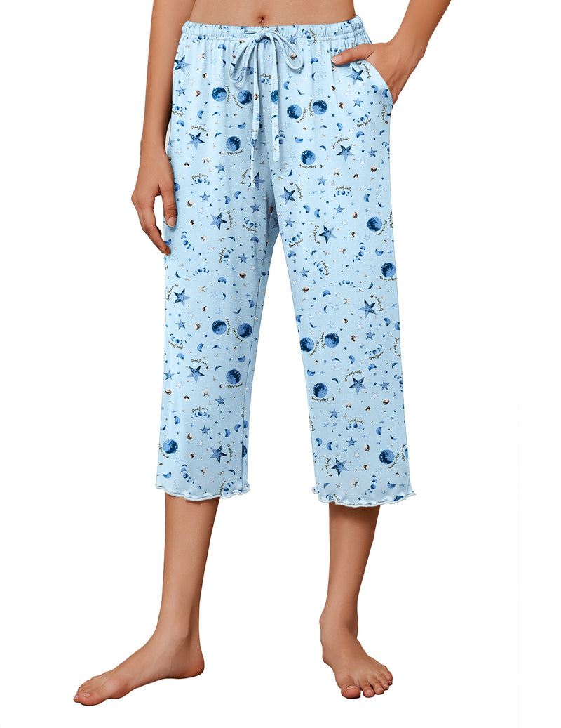 Light blue pajama capri pants with wide legs, allover star and moon print, drawstring waist