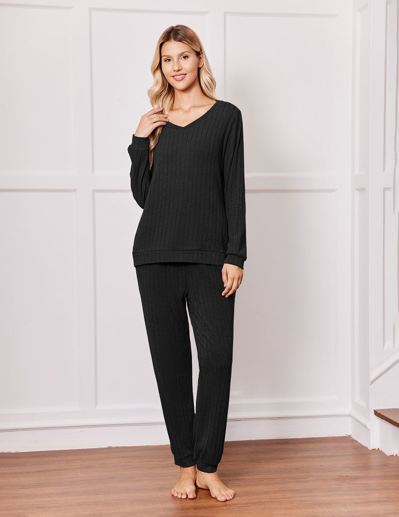 Black ribbed pajama set: V-neck long-sleeve top with drawstring jogger pants.