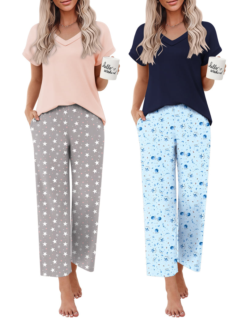 Two women’s short-sleeve V-neck pajama sets: blush solid and dark navy star print