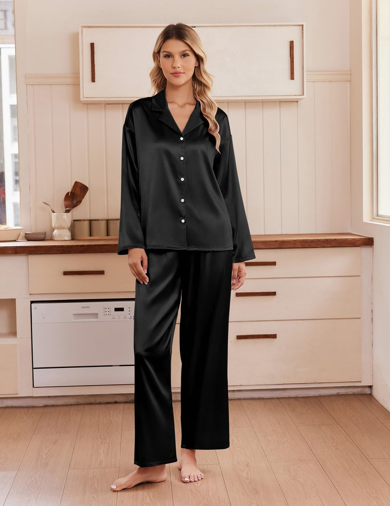Black satin notch-collar button-up pajama set with long sleeves and matching pants