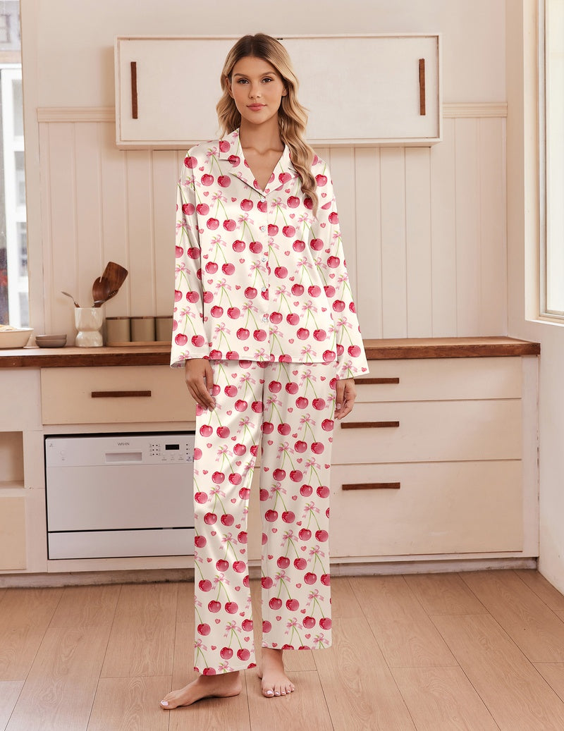 Pink satin pajama set with notch collar, button front, and long-sleeve matching pants