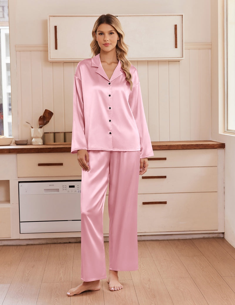 Light pink satin pajama set with notch collar, long sleeves, button front, and matching pants