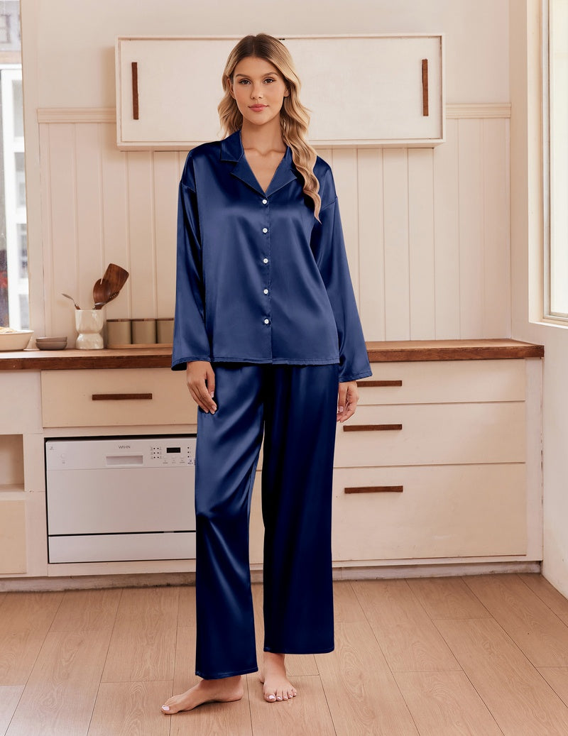 Navy blue satin pajama set with notch collar, long sleeves, button front, and matching pants