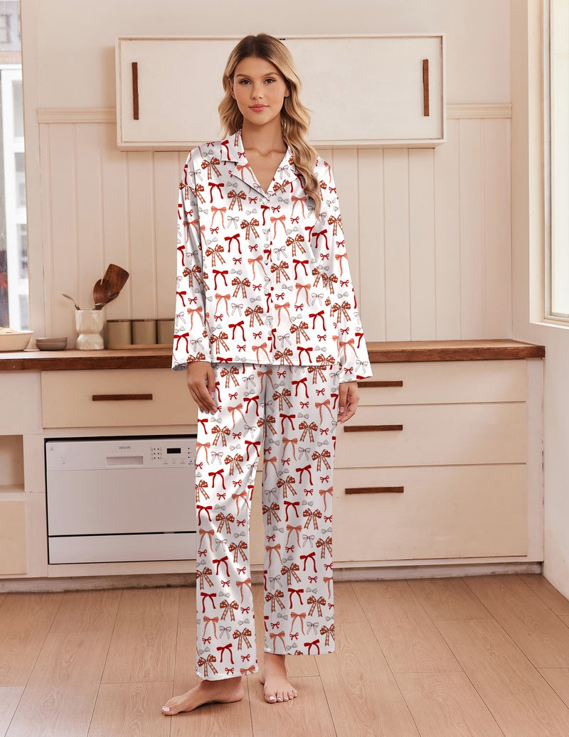 White satin pajama set with red animal print, notch collar, long sleeves, button front, pants