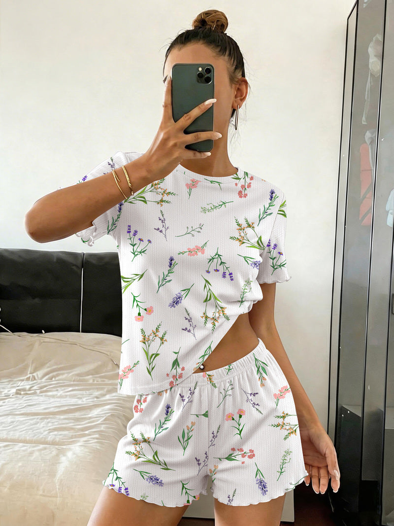 Ribbed crop top and shorts pajama set in white with colorful floral print, elastic-waist shorts