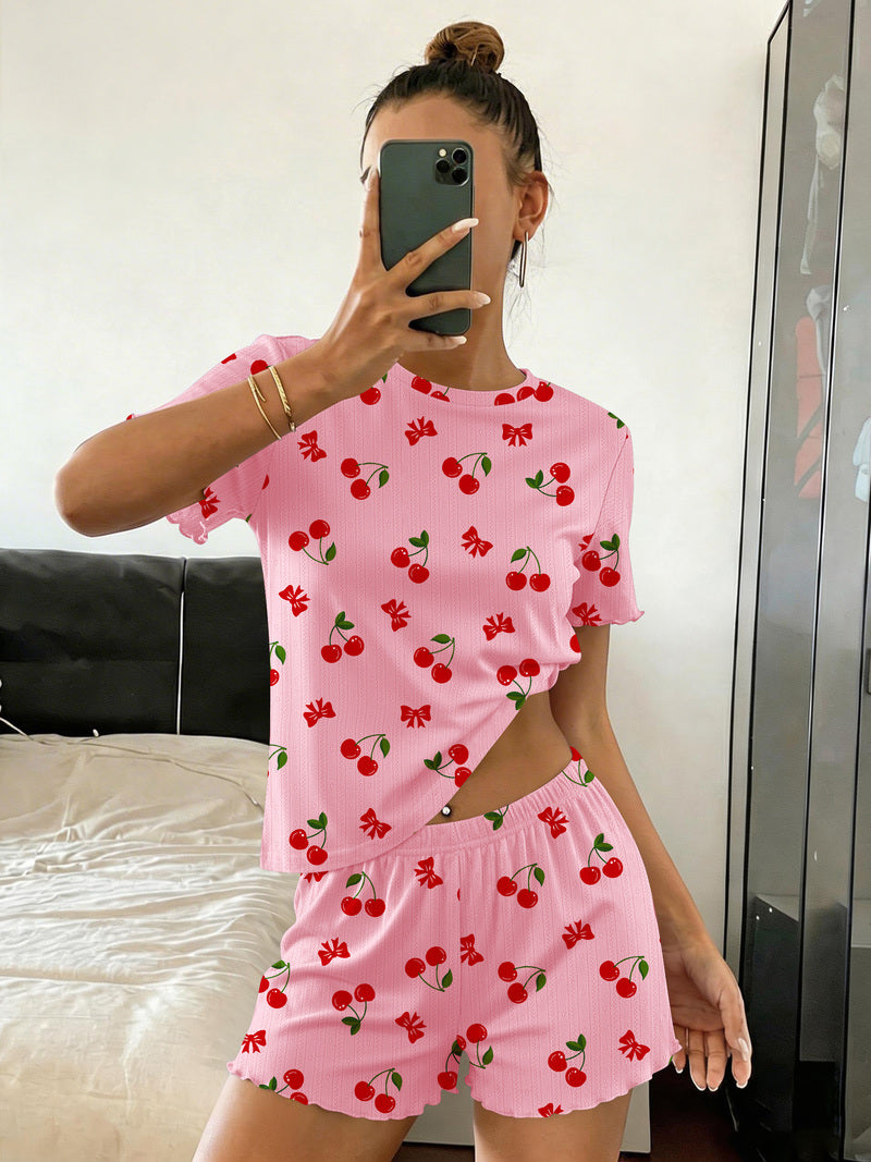 Ribbed crop top and shorts pajama set in pink with red cherry print, elastic-waist shorts