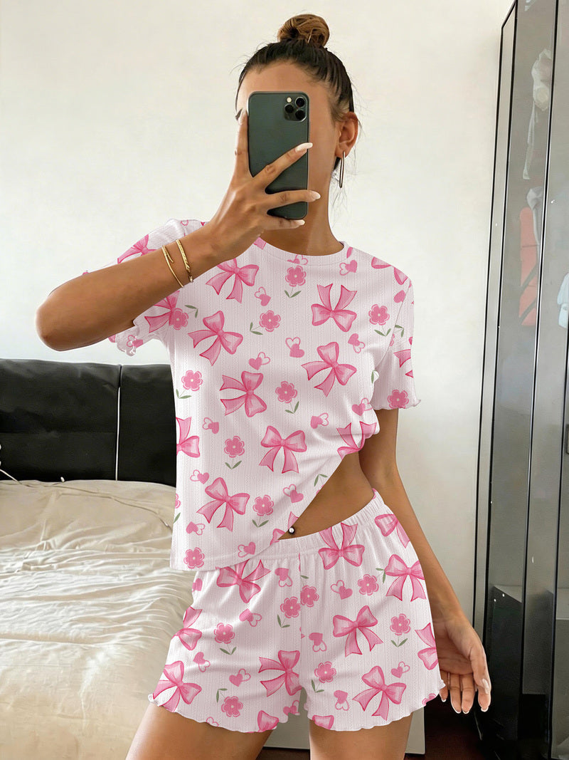 Bow-print crop pajama top and shorts set in white with pink bows