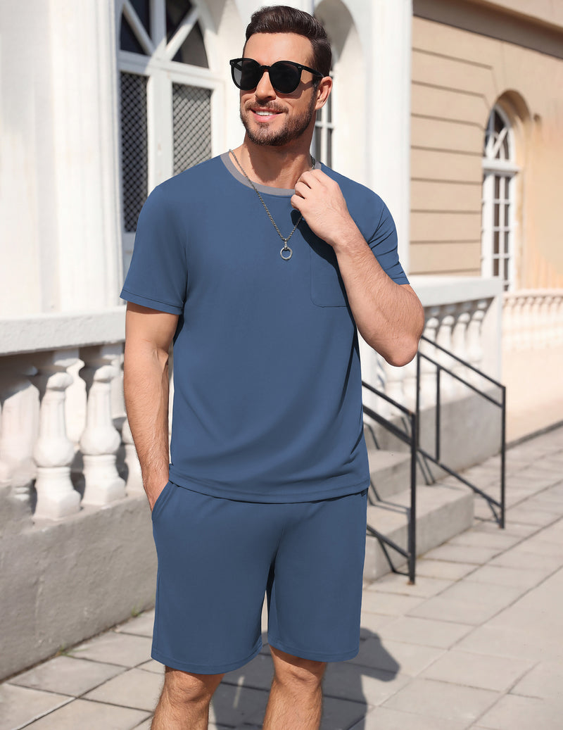 Men's short-sleeve pajama set, slate-blue top and matching shorts, standing front.