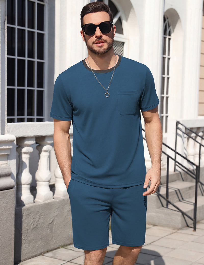 Men's short-sleeve pajama set, medium-blue top and matching shorts, standing front.