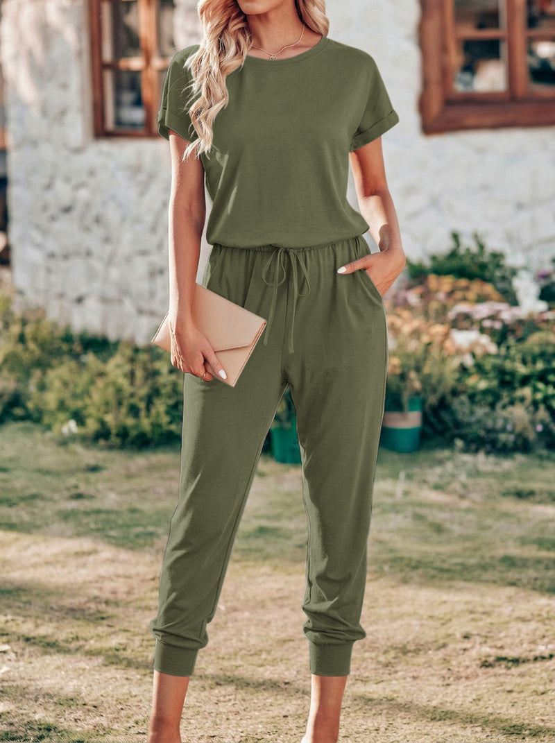 Olive green drawstring jumpsuit with short sleeves and elastic waist, cropped tapered pants