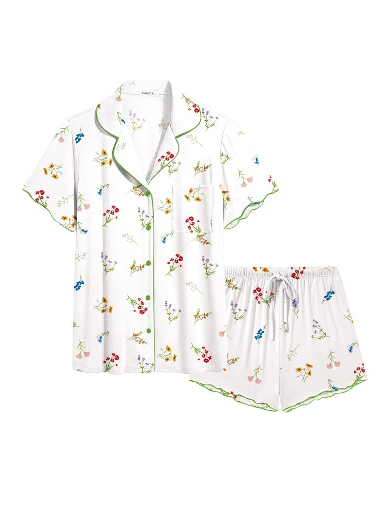 White ruffle button-up pajama set with multicolor floral print and matching drawstring shorts