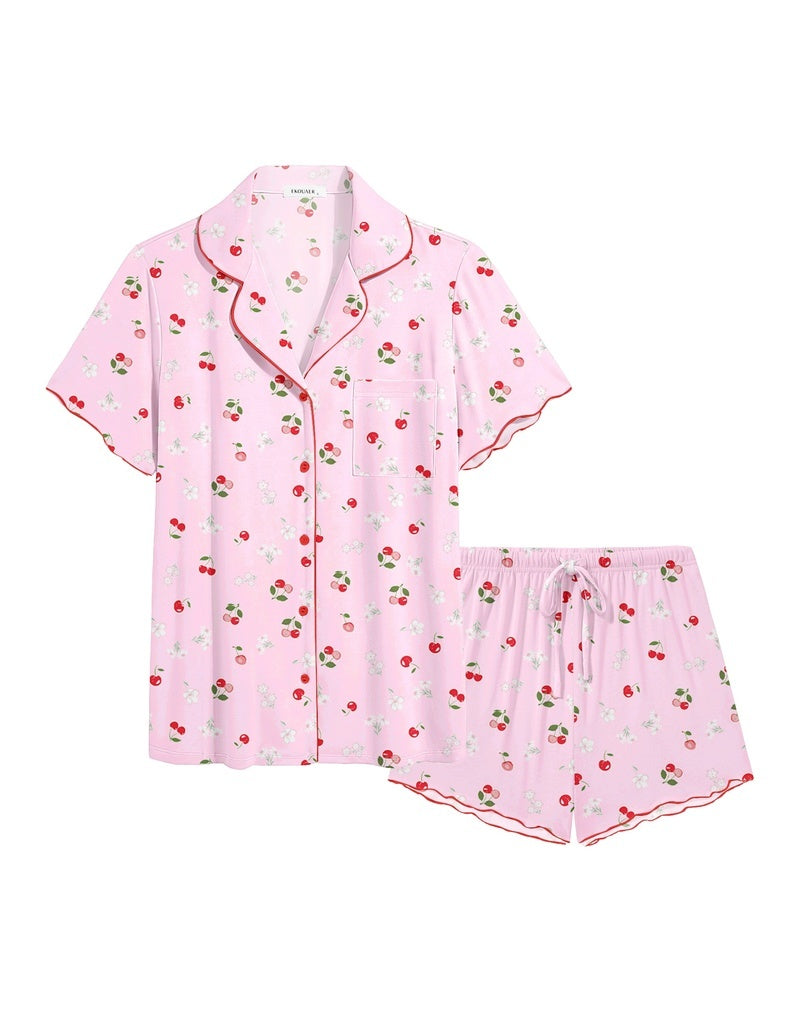 Light pink ruffle button-up pajama set with tiny fruit and leaf print drawstring shorts