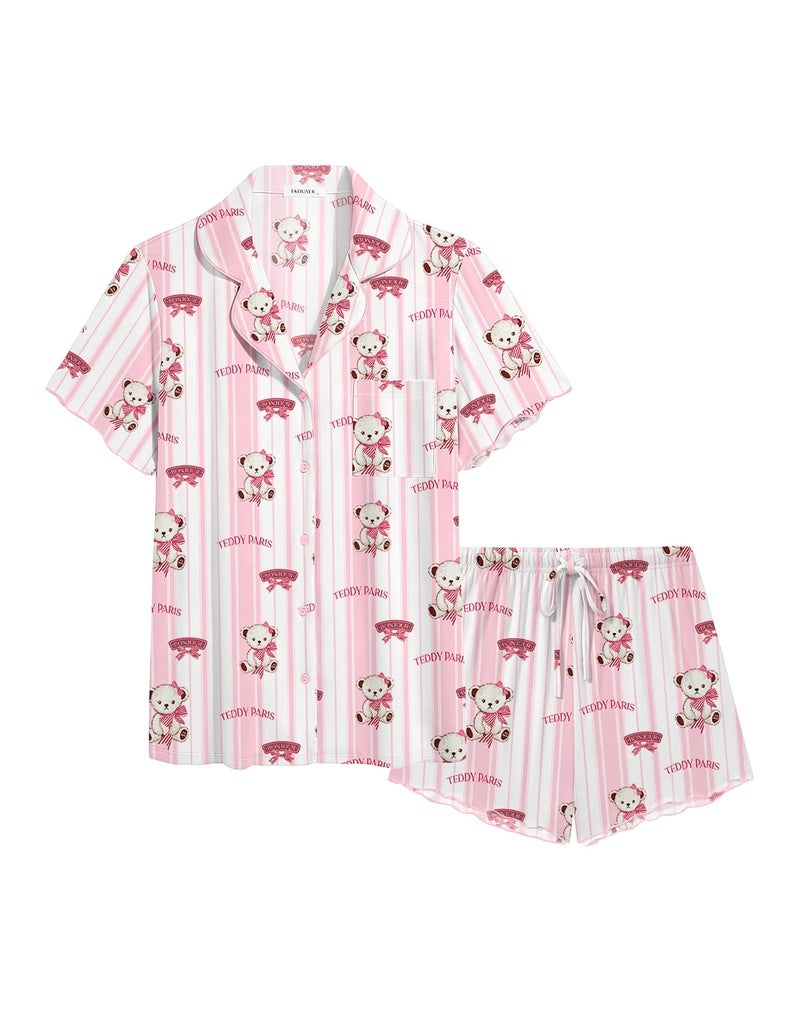 Pink ruffle pajama set with cartoon prints and striped button-up top plus drawstring shorts